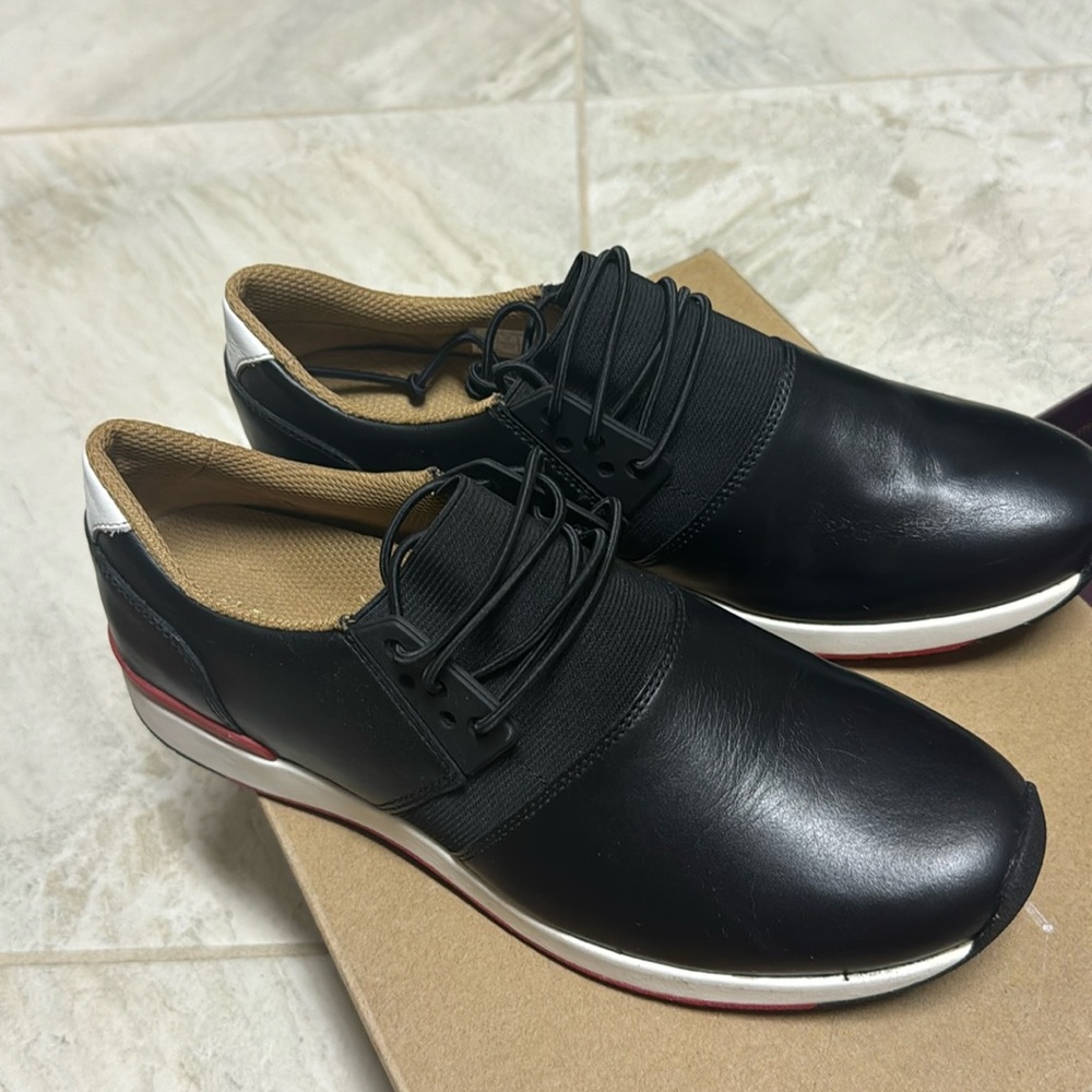 Vionic women’s black fashion, sneaker, leather upper.